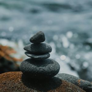 Close-up of a smooth stone, representing calm and stability.